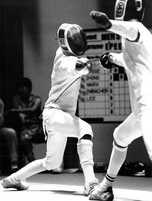 Martin Brill (left) competing in the first round epee during the Men's Fencing event at the Games of the XXIII Olympiad, Los Angeles 1984. Photo: New Zealand Olympic Museum Collection.
