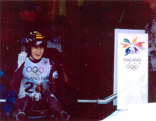 Angela (Paul) Edmond waves to the camera during the women's luge event at the XVIII Olympic Winter Games, Nagano 1998. Photo: New Zealand Olympic Museum Collection.